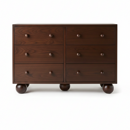 Wooden dresser with six drawers and round legs a white background