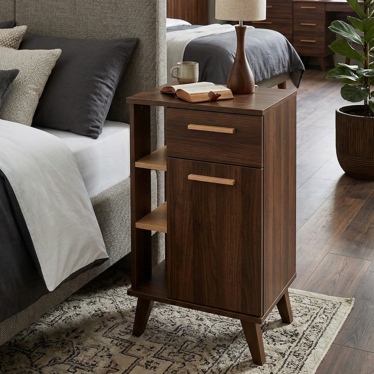 Wooden nightstand with books and a mug next to a bed in a bedroom setting.