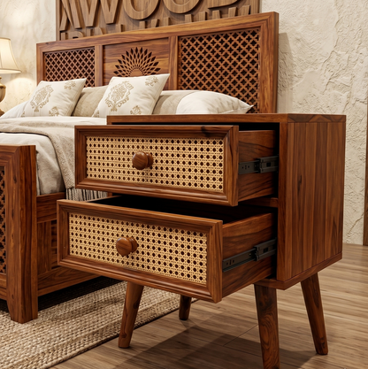 Wooden nightstand with wicker drawers in a bedroom setting