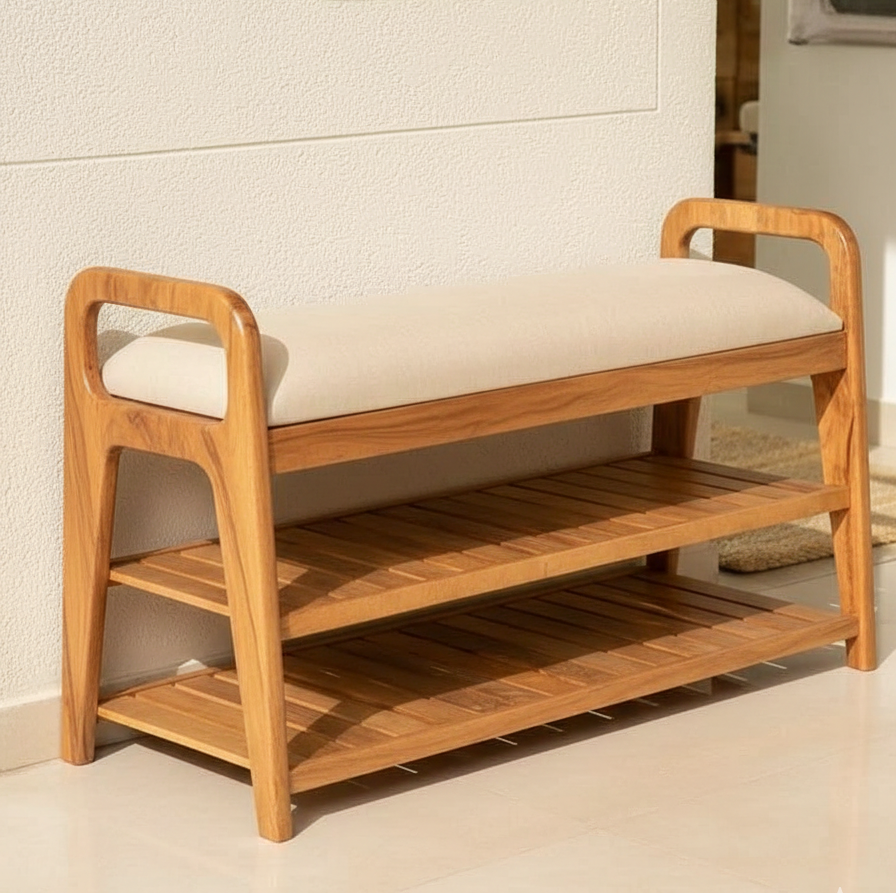 Wooden shoe bench with cushioned seat against a white wall