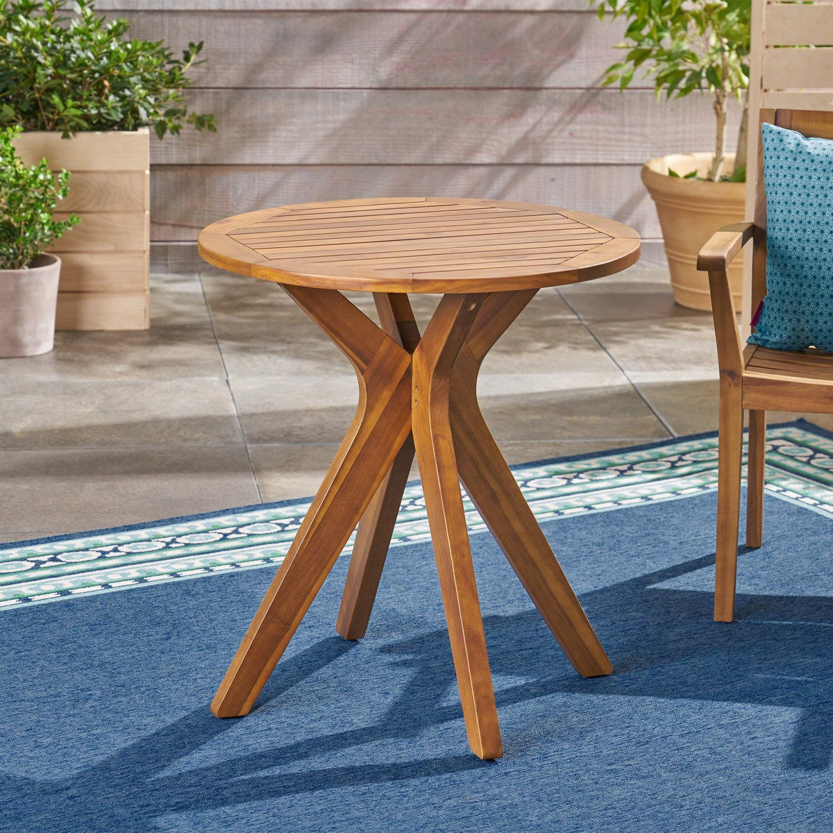 Wooden outdoor table with chairs on a patio