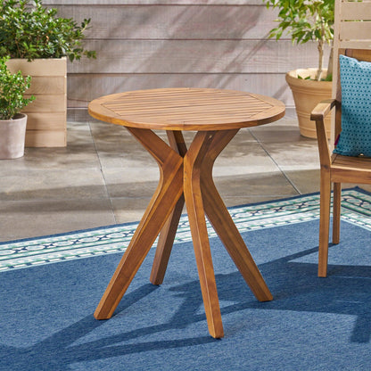 Wooden outdoor table with chairs on a patio