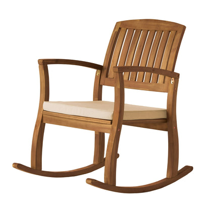 Wooden rocking chair with beige cushion on a white background