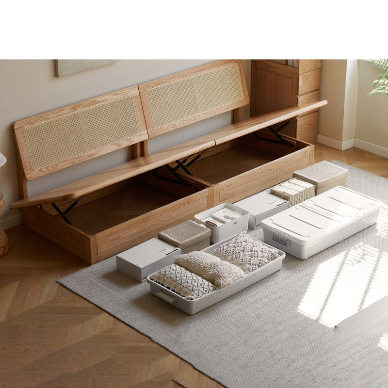 Wooden storage bed with open drawers in a room setting