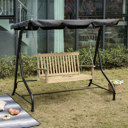Wooden swing with black metal frame on grass, outdoor setting