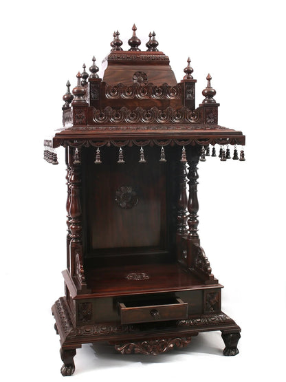 Wooden temple structure with intricate carvings on a white background