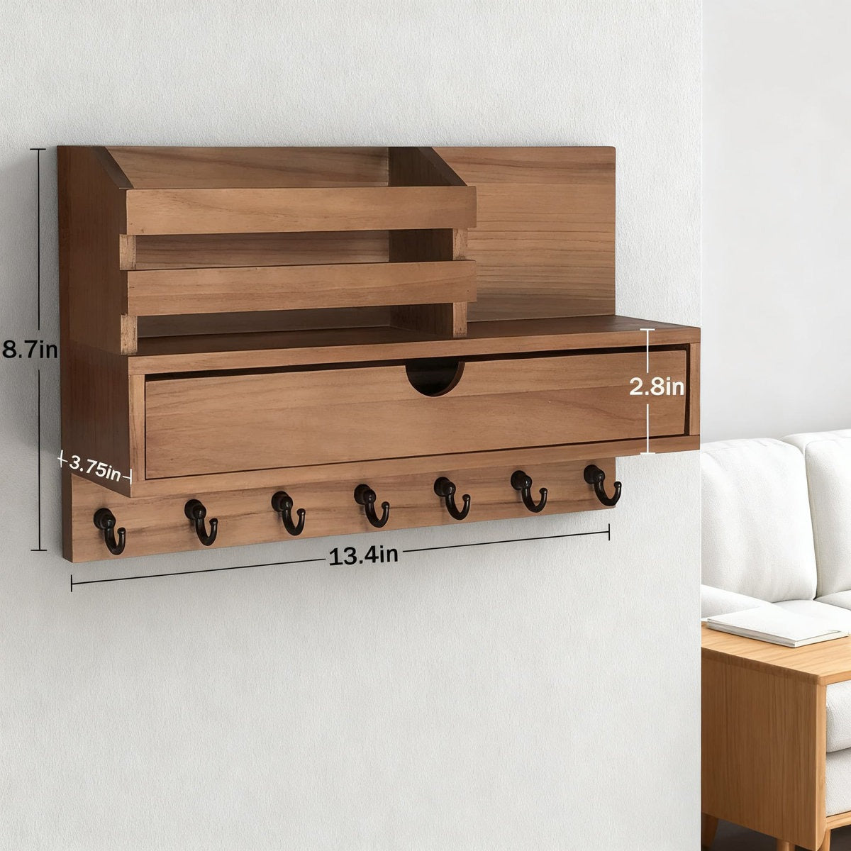 Wooden wall-mounted shelf with hooks and measurements on a white background