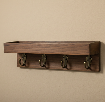 Wooden wall shelf with four hooks on a beige wall