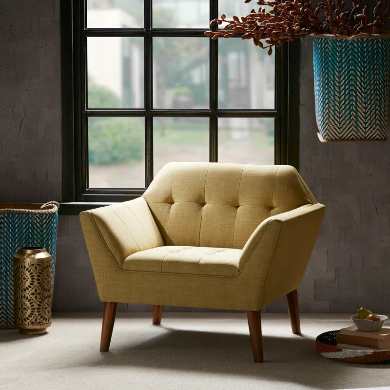 Yellow armchair in a room with a large window and decorative elements.