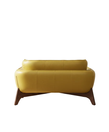 Yellow sofa with wooden legs on a white background