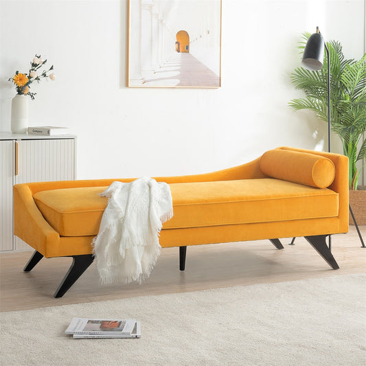 Yellow velvet bench in a modern living room with a white rug and decorative elements.