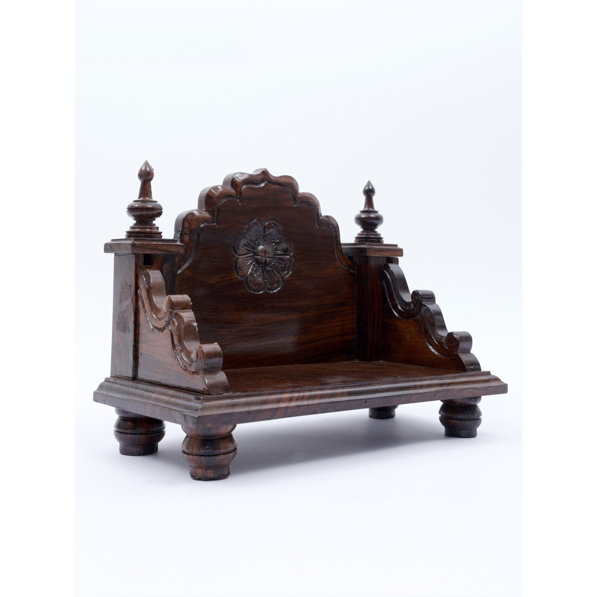 Wooden throne chair with intricate carvings on a white background