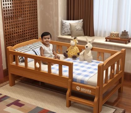 Child sitting on a wooden bed with checkered bedding in a room setting.