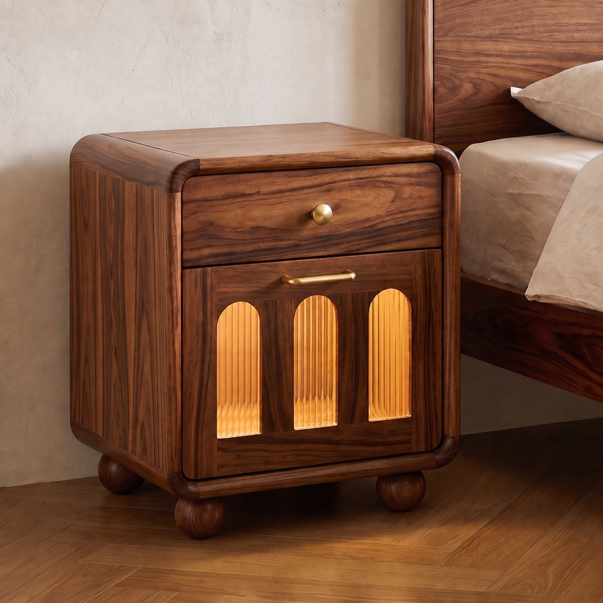 A dark brown wooden nightstand with a single drawer and a lower cabinet featuring three arched glass panels that glow with warm light, shown beside a bed in a bedroom setting.