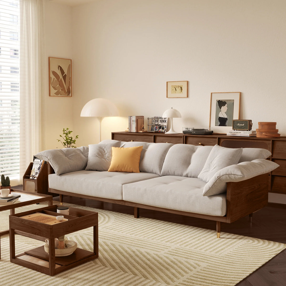 Modern living room with a gray sectional sofa, wooden coffee table, and decorative items.