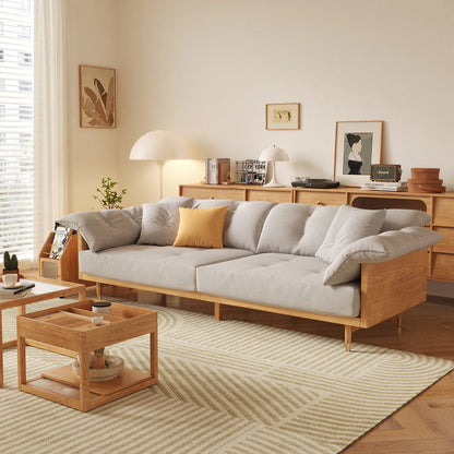 Living room with a gray sofa, wooden coffee table, and decorative items.