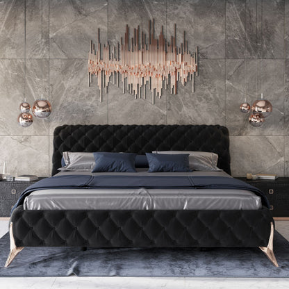 A luxurious upholstered bed with gold legs, placed against a modern grey wall with decorative lighting above it.