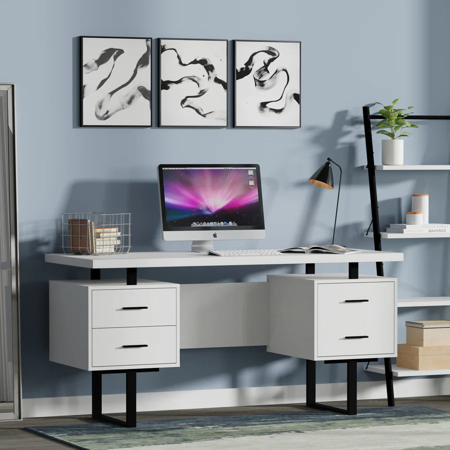 A modern study table with solid Sheesham wood top, metal legs in black, and built-in drawers and cabinets finished in white and walnut. The table is set against a light blue wall with framed abstract art above it, and a computer monitor, lamp, and decorative items are placed on the table.