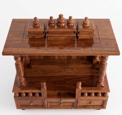 A polished dark brown wooden chess display cabinet with a hinged top lid, featuring four chess pieces mounted on the top surface. The cabinet has ornate turned legs, drawers, and brass hardware, with 'ADOUER WOOD FURNITURE' engraved on the front right side of the tabletop.