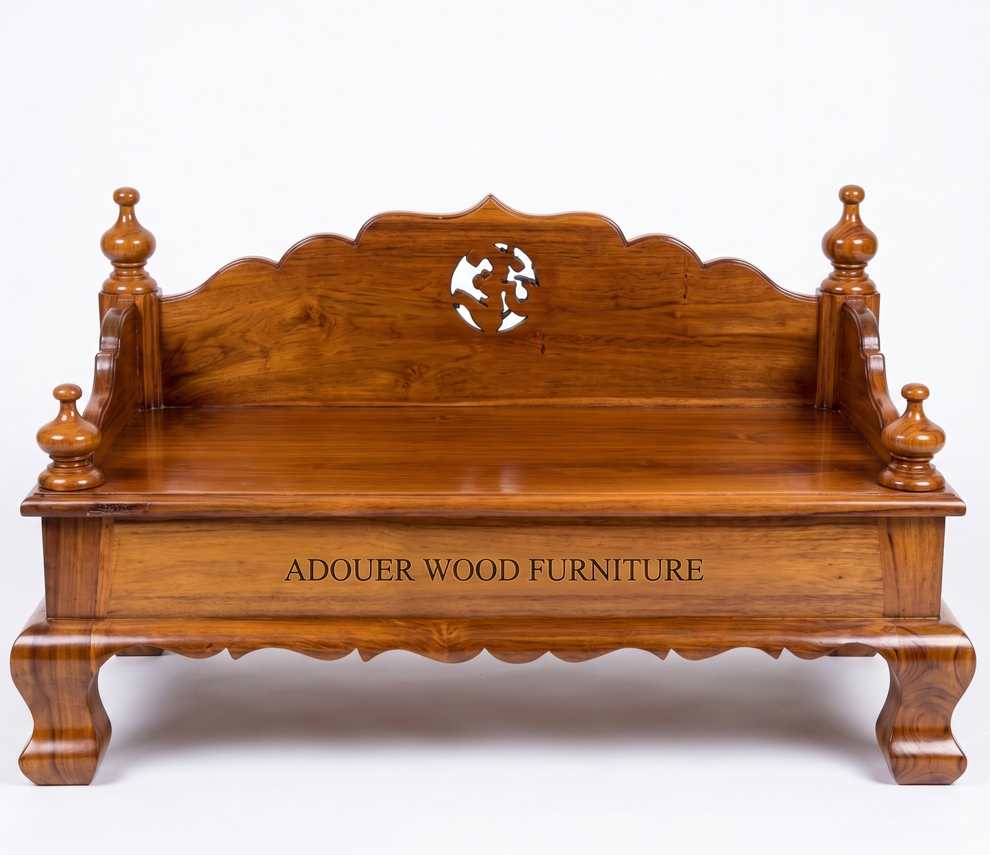 A polished reddish-brown wooden bench with ornate turned legs, a scalloped backrest, and a central cutout featuring a stylized figure. The front panel is engraved with the text 'ADOUER WOOD FURNITURE'.