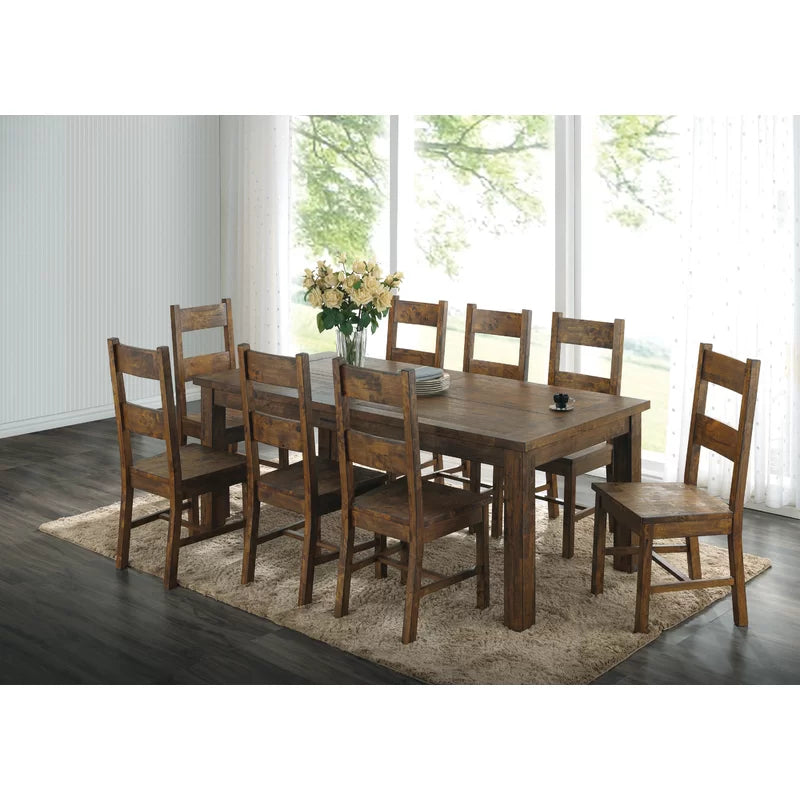A rustic style 8-piece dining set by Adouer Wood, featuring a solid wood table with a walnut finish and eight matching chairs on a plush rug.
