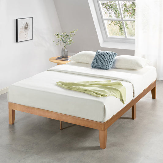 A solid sheesham wood platform bed with a mattress on top, placed in a room with light decor and a window view.