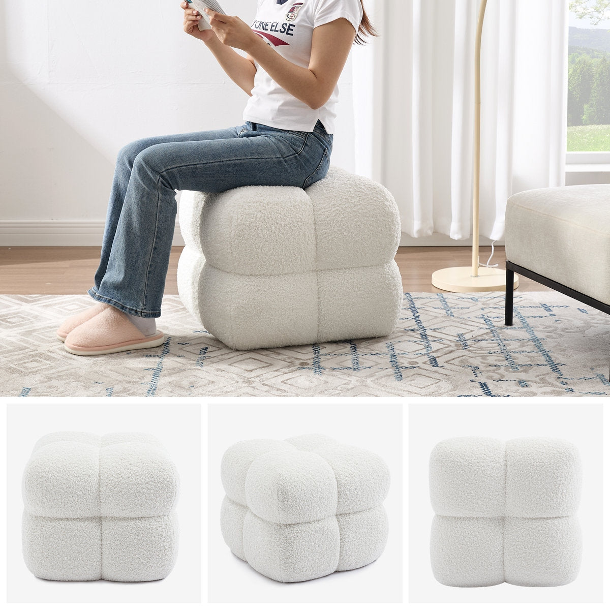 Person sitting on a textured white ottoman in a room with a rug and window.