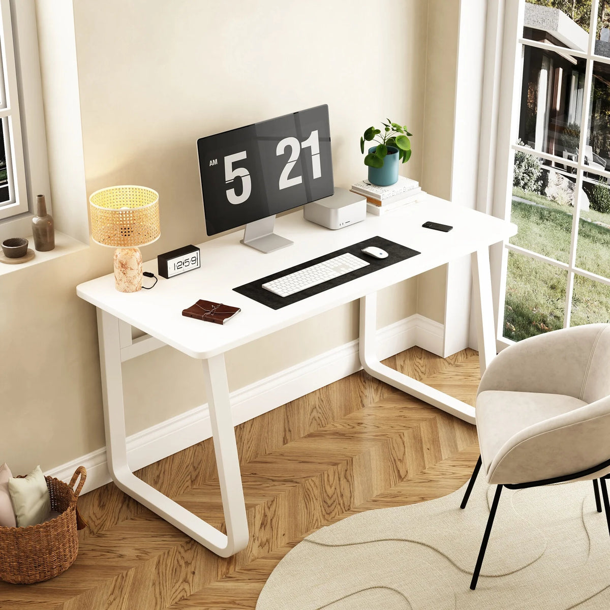 A white classic study table with round edges and a digital clock on top, placed in a room with a chair and a lamp.
