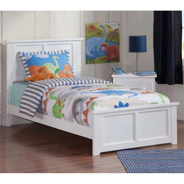 A white, solid sheesham wood children's bed with a milky white finish, adorned with colorful bedding and decorative wall art in a child's bedroom.