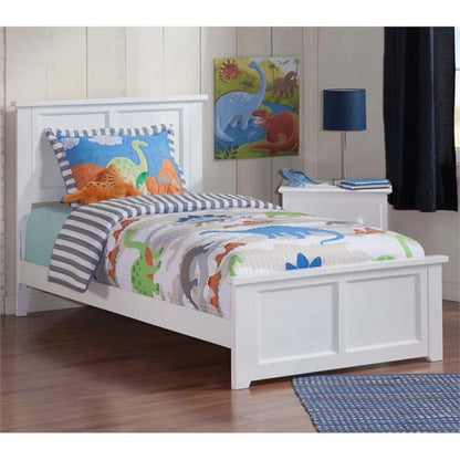 A white, solid sheesham wood children's bed with a milky white finish, adorned with colorful bedding and decorative wall art in a child's bedroom.