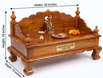 A wooden altar bench or sofa-style table shown on a white background with dimension arrows and labels indicating width 30 inches, height 18 inches, and depth 15 inches. The bench is made of warm medium-brown wood and includes decorative carved details, turned finials, a central cutout, a brass plaque reading 'ADQUER WOOD FURNITURE,' a small statue, brass incense holders, and orange marigold flowers placed on top.