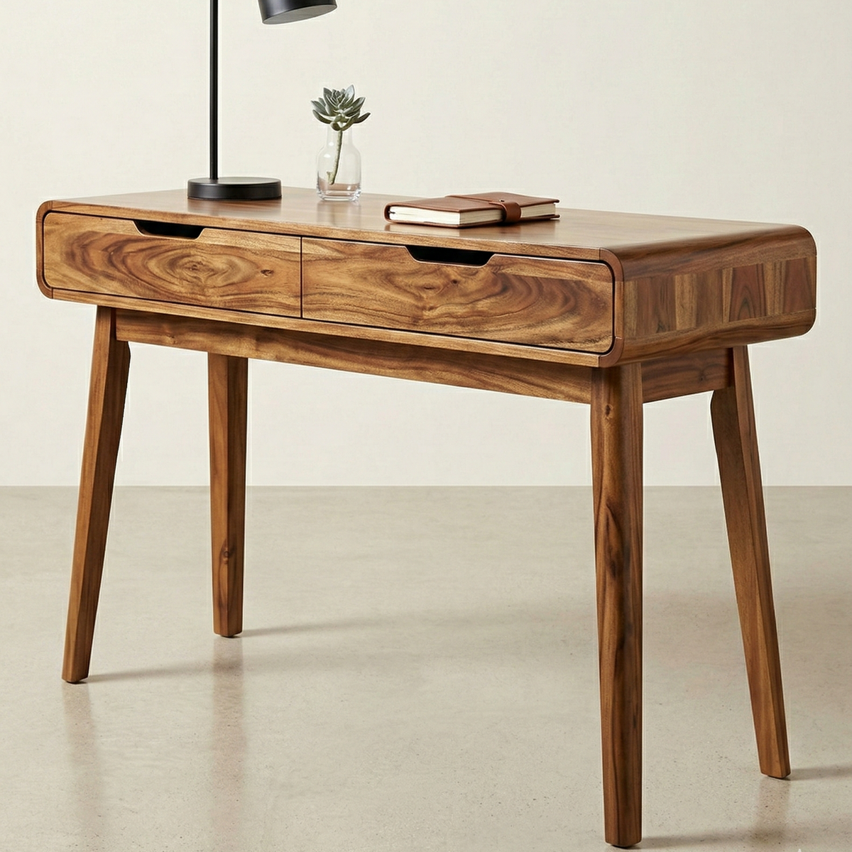 Wooden desk with two drawers on a plain background