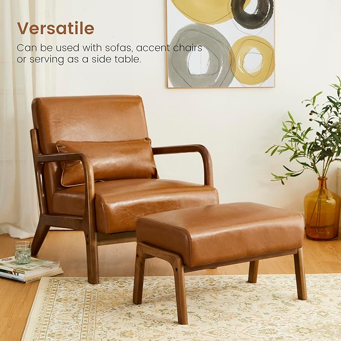 Brown leather armchair and ottoman in a living room setting with a decorative painting on the wall.