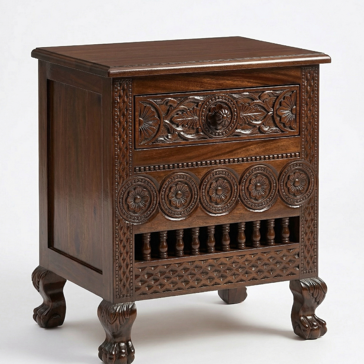 Carved wooden nightstand with intricate designs on a white background