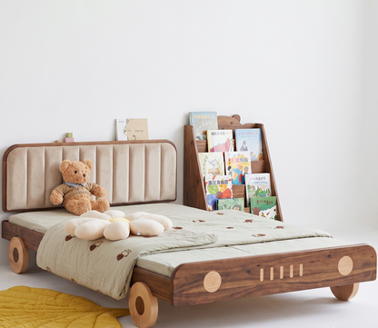 Children's bed with unique design and books on a white background
