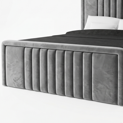 Gray upholstered bed with a tufted headboard on a white background