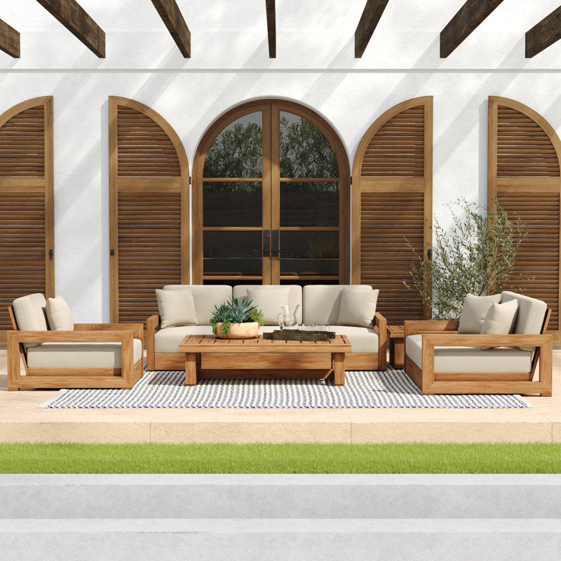 Outdoor patio furniture set with wooden frames and beige cushions on a patio with wooden shutters.