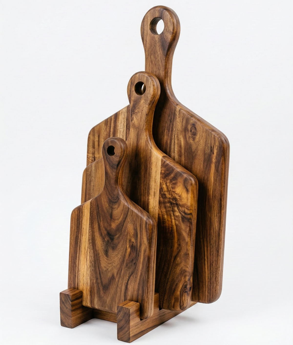 Set of wooden cutting boards with handles on a white background