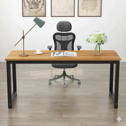 Wooden desk with office chair, lamp, and decor in a room.