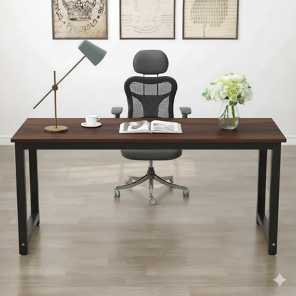 Modern office desk with chair, lamp, and decor items in a room.