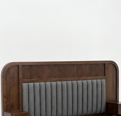 Wooden headboard with gray upholstered panel on a white background