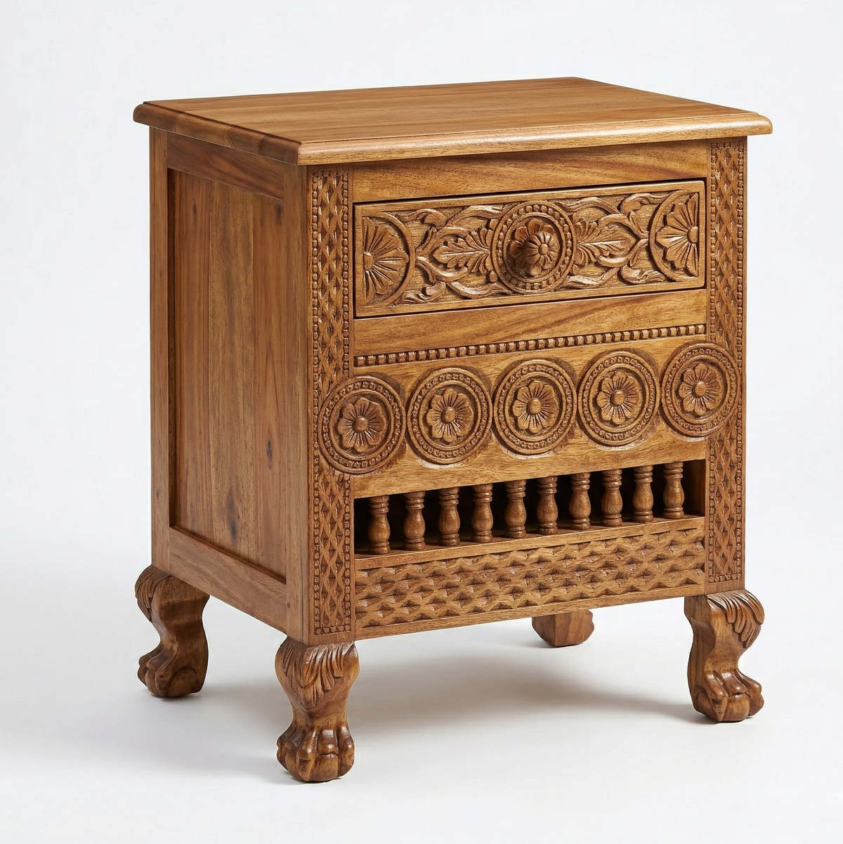 Wooden nightstand with intricate carvings on a white background