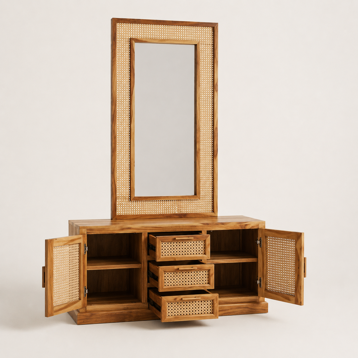 A wooden vanity cabinet with an attached tall mirror, featuring natural woven cane or rattan panels on the mirror frame, drawer fronts, and side doors. The cabinet has three central drawers and open side compartments, shown against a plain light background with doors open to display storage.