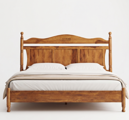 A wooden bed frame with a warm medium-brown finish, styled with white bedding and pillows. The brand name 'ADOUER' is engraved on the headboard.