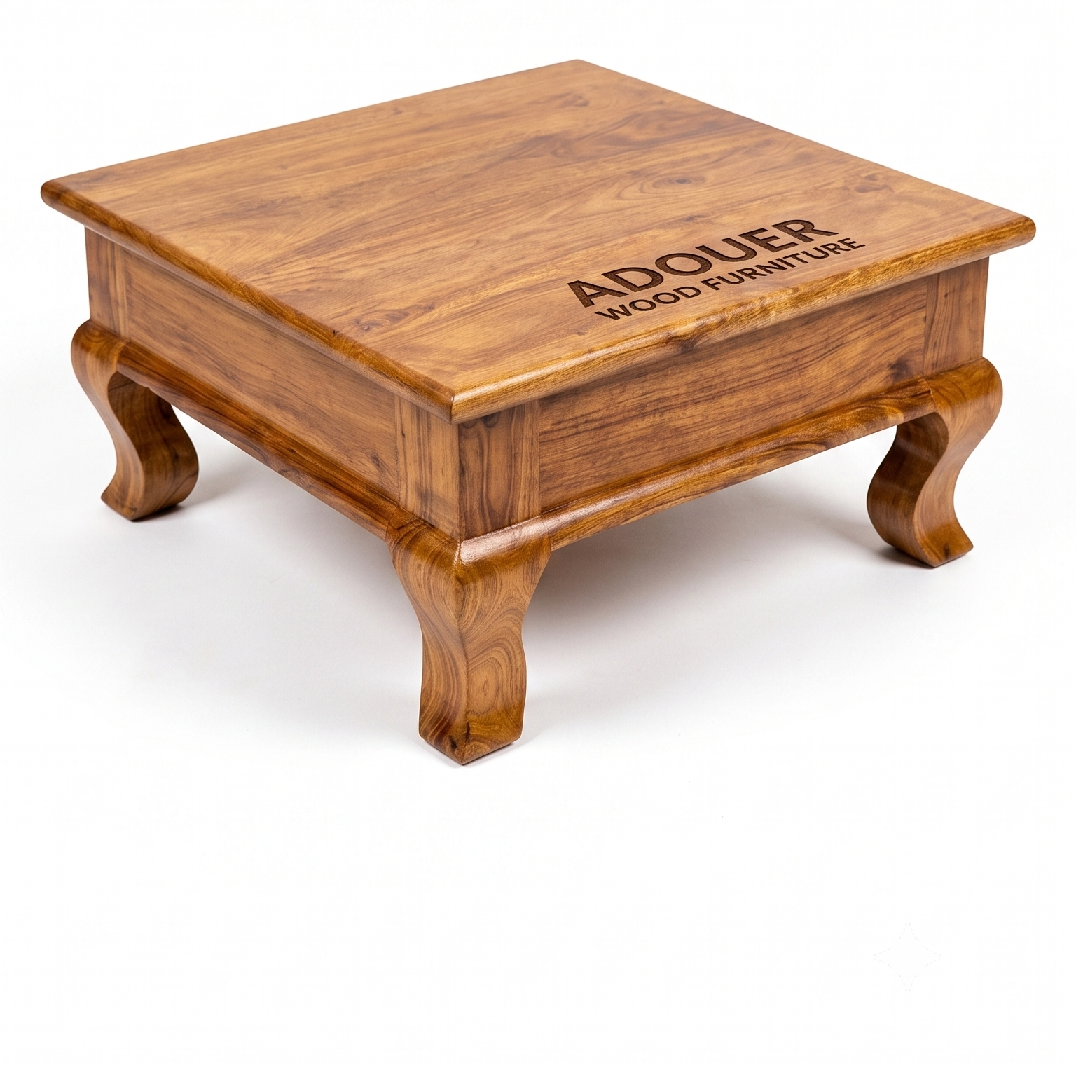A square wooden coffee table with a rich warm brown finish and carved legs, featuring the brand name 'ADOUER WOOD FURNITURE' engraved on the top surface, set against a plain white background.